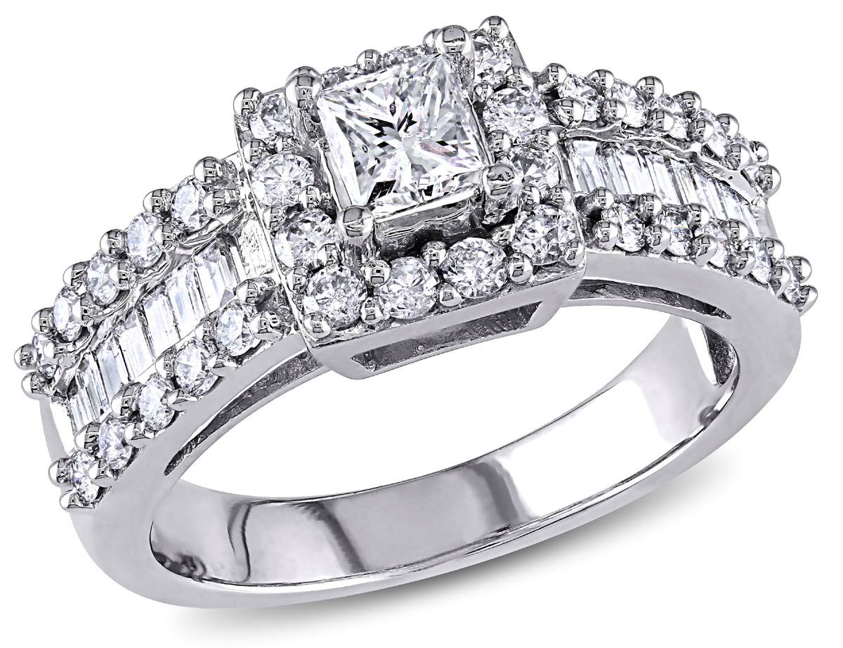 To symbolize your commitment, this  Princess, Round, and Baguette-cut Diamond Engagement Ring is a stunning choice. The white gold ring is prong set with a dazzling princess-cut diamond at center, surrounded by 12 fiery round, prong-set side diamonds. The wide-style band shimmers with a center row of channel-set, baguette-cut diamonds, totalling 14, edged at each side with a total of 20 round, prong-set diamonds. 14 karat white gold completes the look.