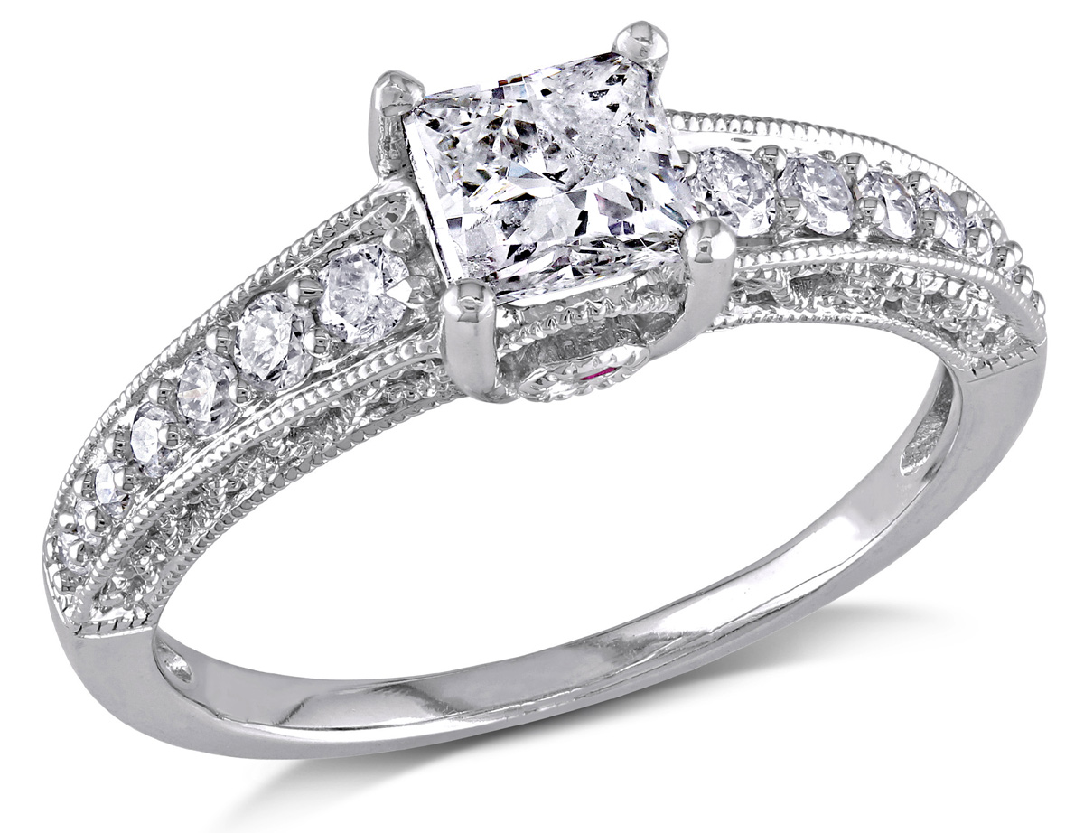 This gorgeous ring features a 3/4 carat princess-cut white diamond center stone band has a infinity motif and a pink sapphire with pave-set diamonds. The ring is crafted of 14-karat white gold and is enhanced a vintage finish.